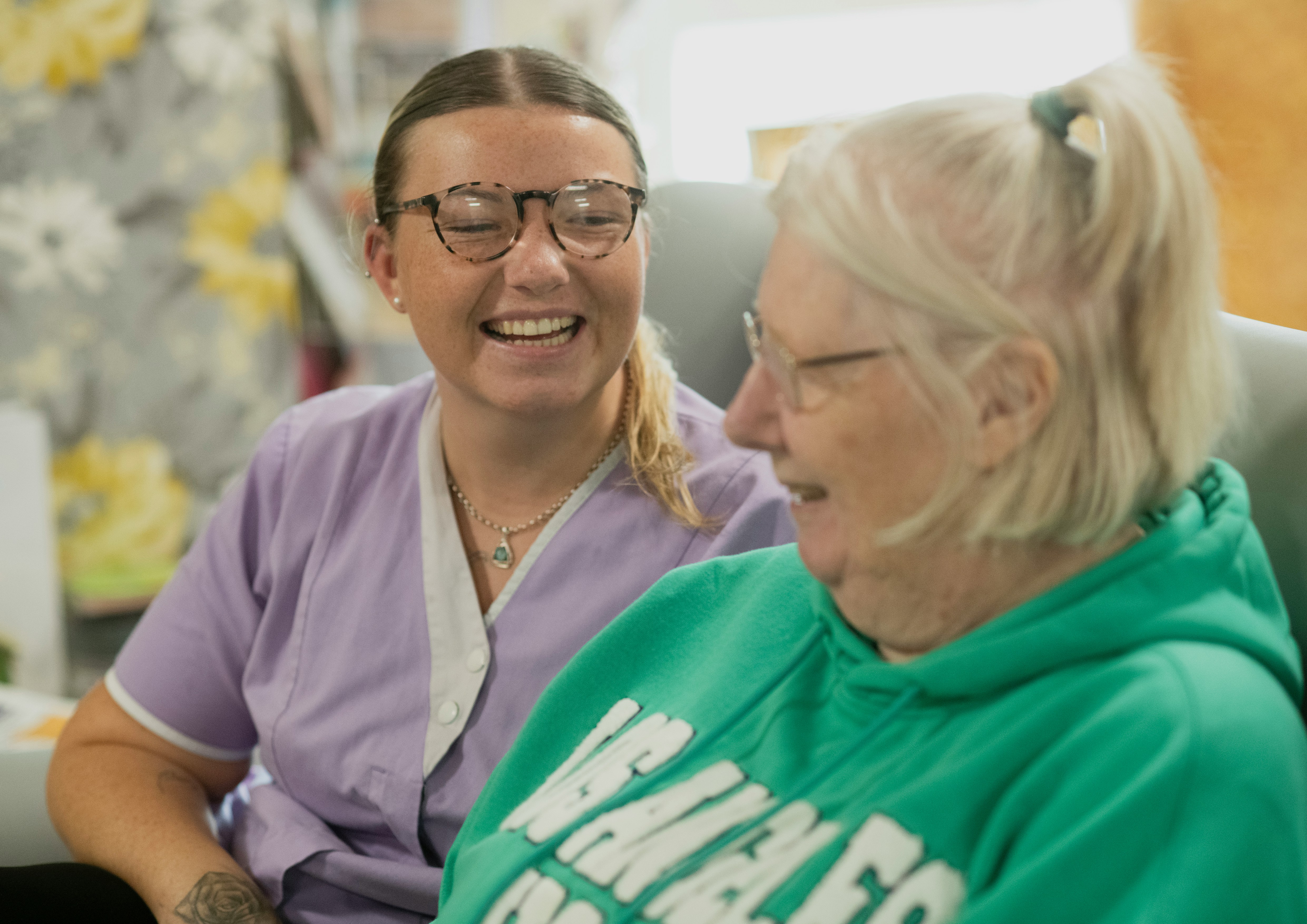 NDIS support worker and participant sharing a laugh
